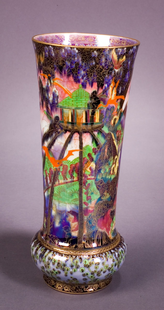 A 17-inch vase is decorated with Imps on a Bridge and Treehouse accented by a flaming wheel border at the foot. An example of Fairyland Lustre at its most creative, the piece brought $42,300 at auction in 2007. Image courtesy of Skinner Inc.